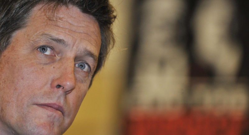 Hugh Grant i Sajid Javid - wojna o jeden uścisk dłoni
